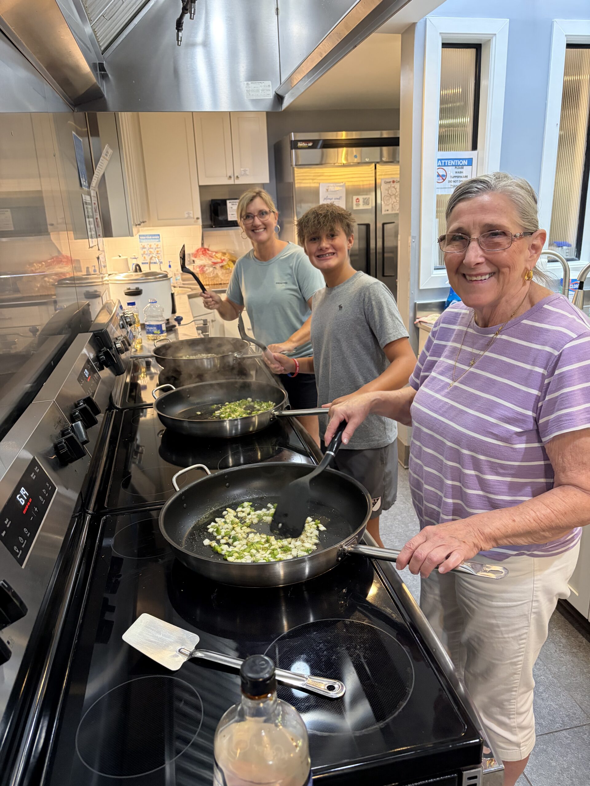 Volunteers with a finished homemade meal ready to serve families at Ronald McDonald House Lexington