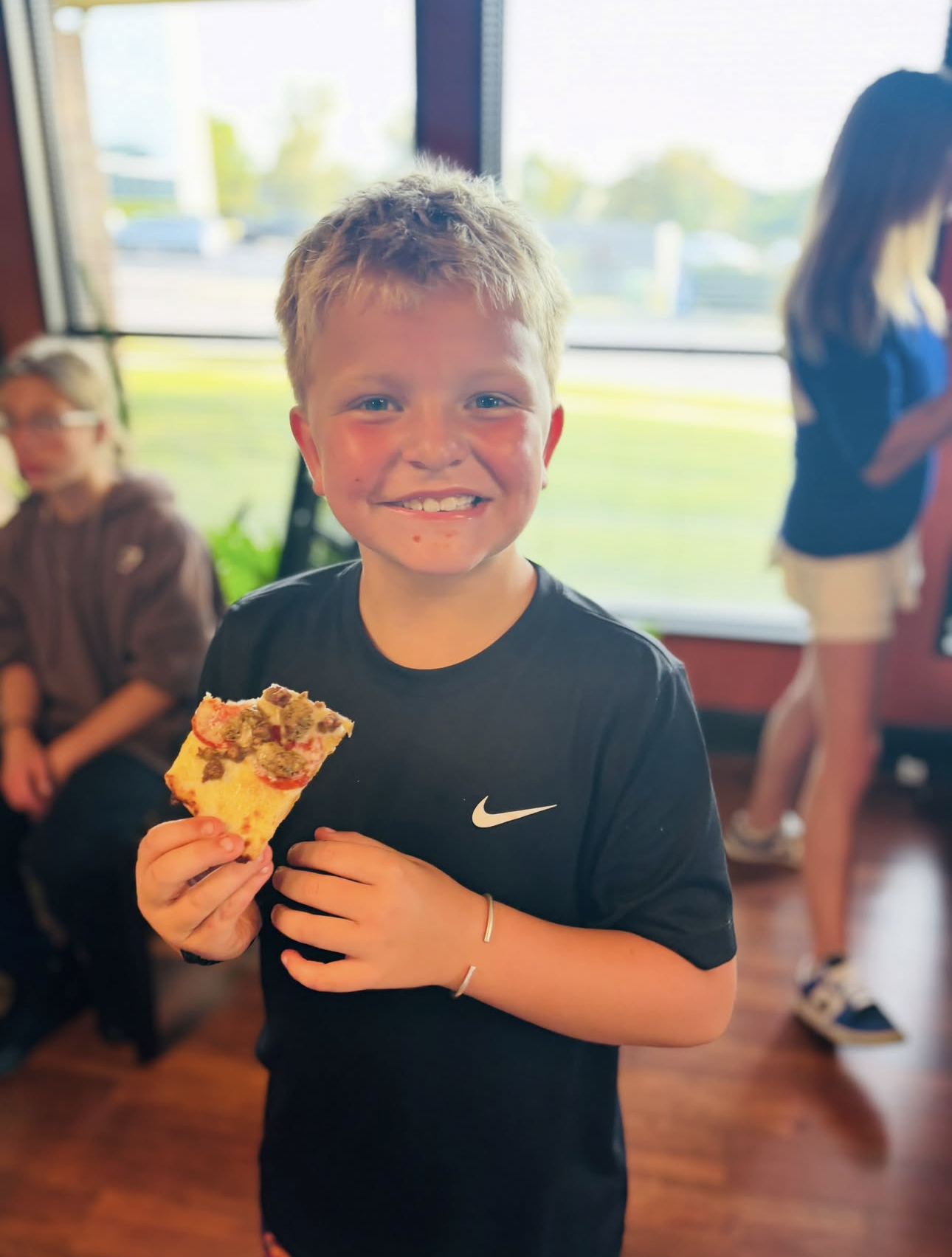 Kid volunteer at the Lunch Packing service day