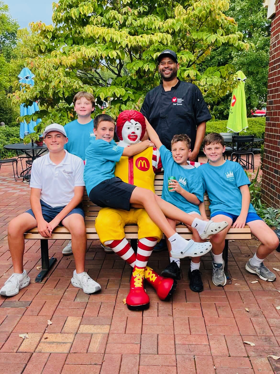 Volunteers with the Ronald McDonald statue outside Ronald McDonald House Lexington