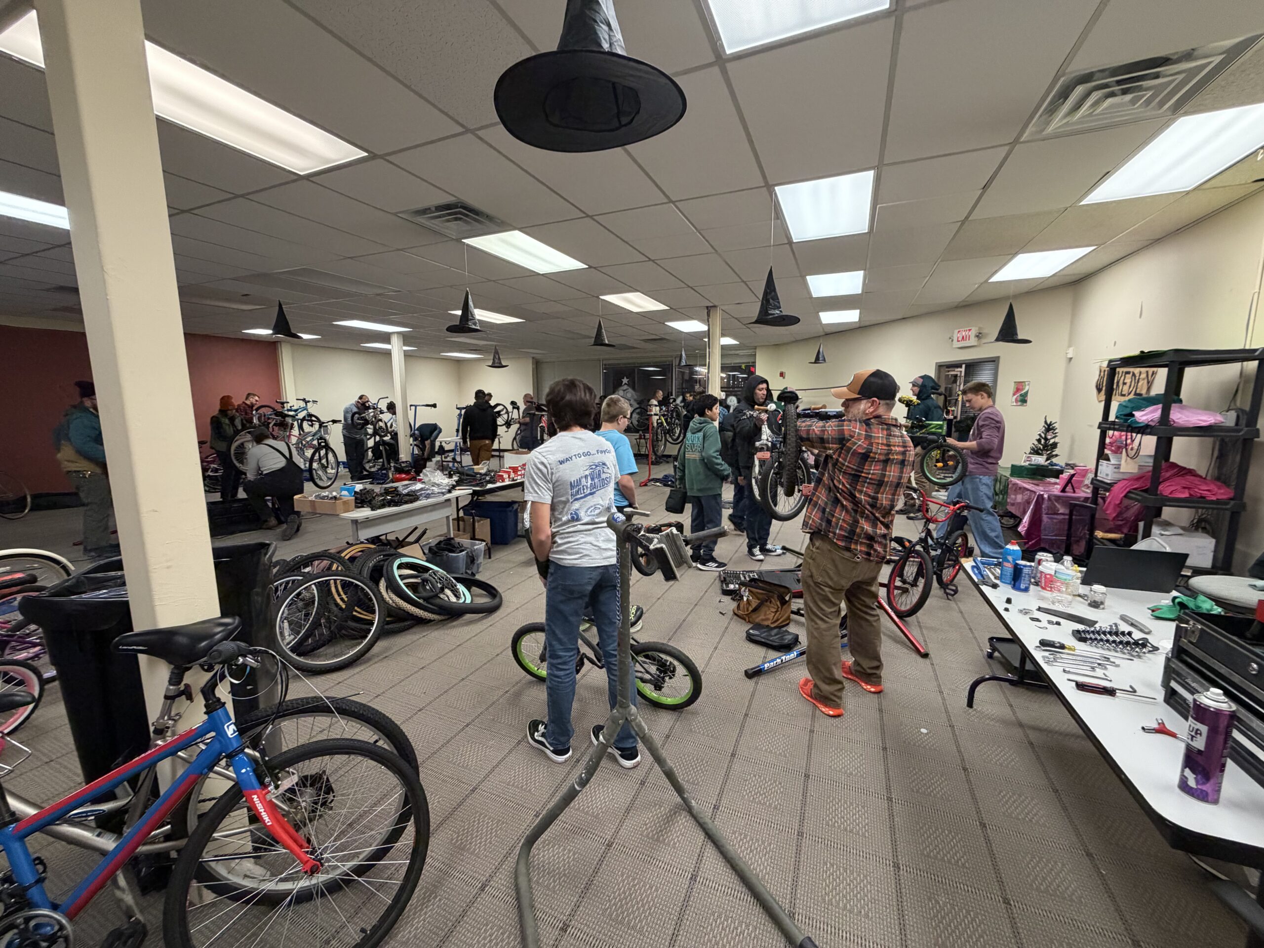 Volunteers moving donated bikes for Operation Secret Santa