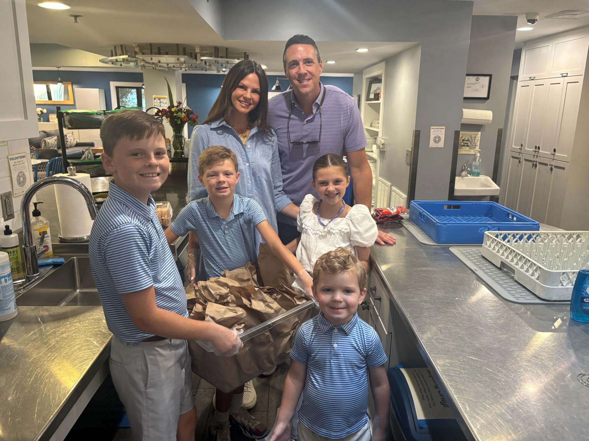 Volunteers with a finished dinner in the RMHL kitchen
