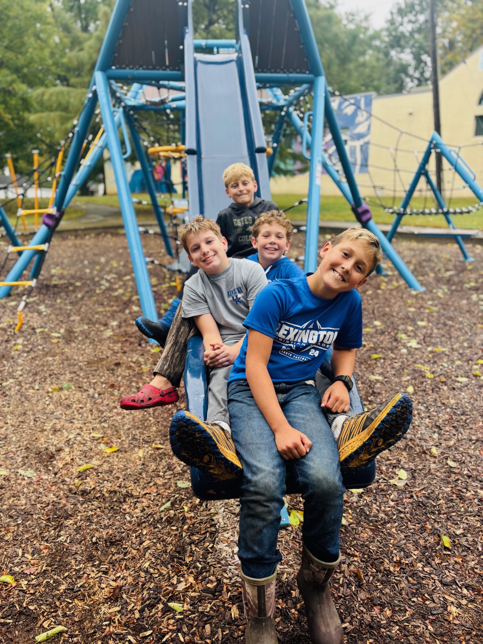 Kids taking a break on the playground swing