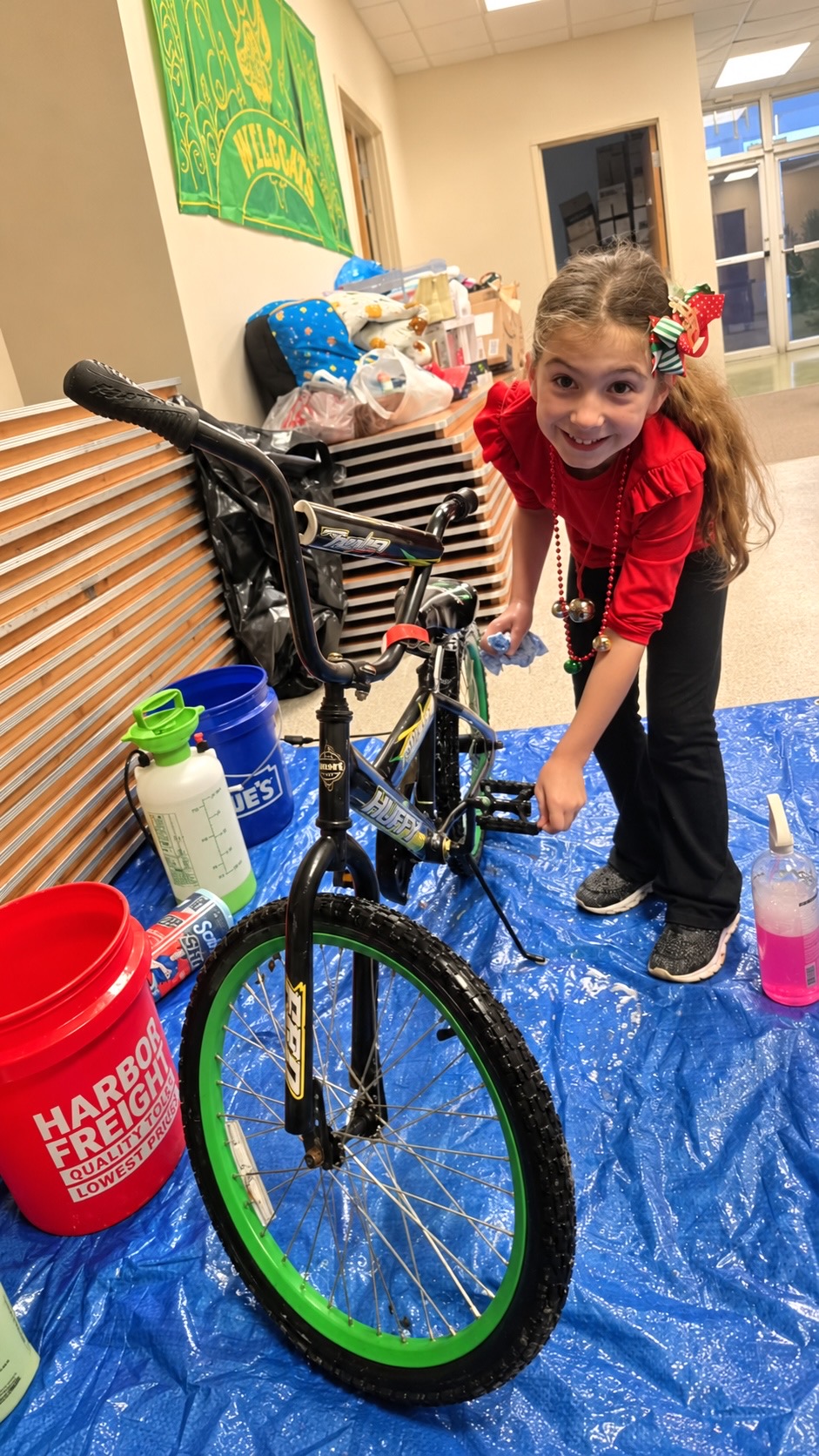 Volunteers washing donated bikes for Operation Secret Santa